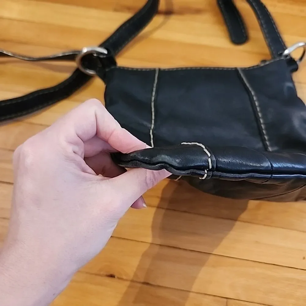 Tignanello black leather Crossbody purse W/accent stitching
